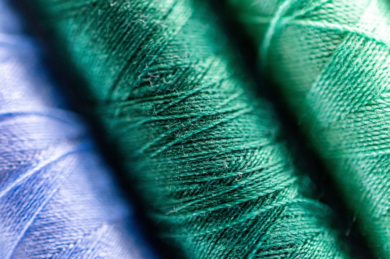 Close-up of embroidery thread and machine work